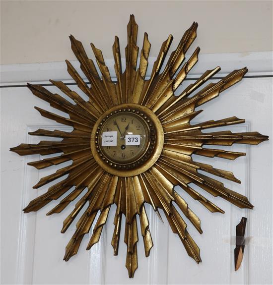 A giltwood sunburst clock, diameter 65cm